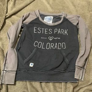 small, grey crew neck from a tourist shop in Estes Park